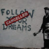 'Follow Your Dreams, Cancelled' street art piece by Banksy