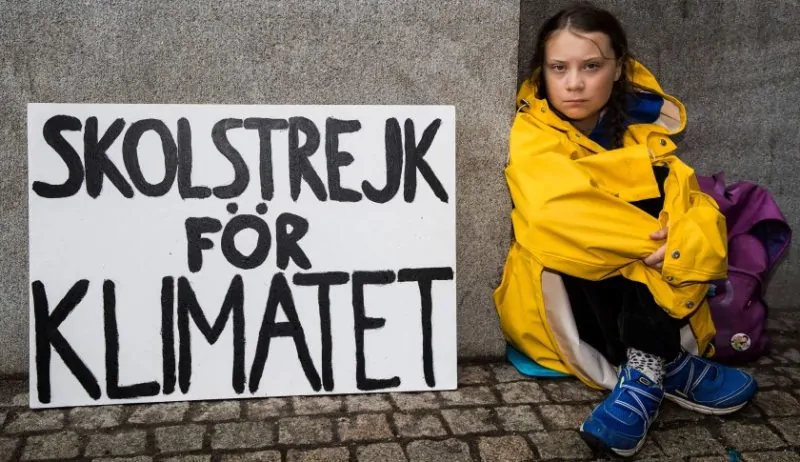 Greta Thunberg striking outside parliament