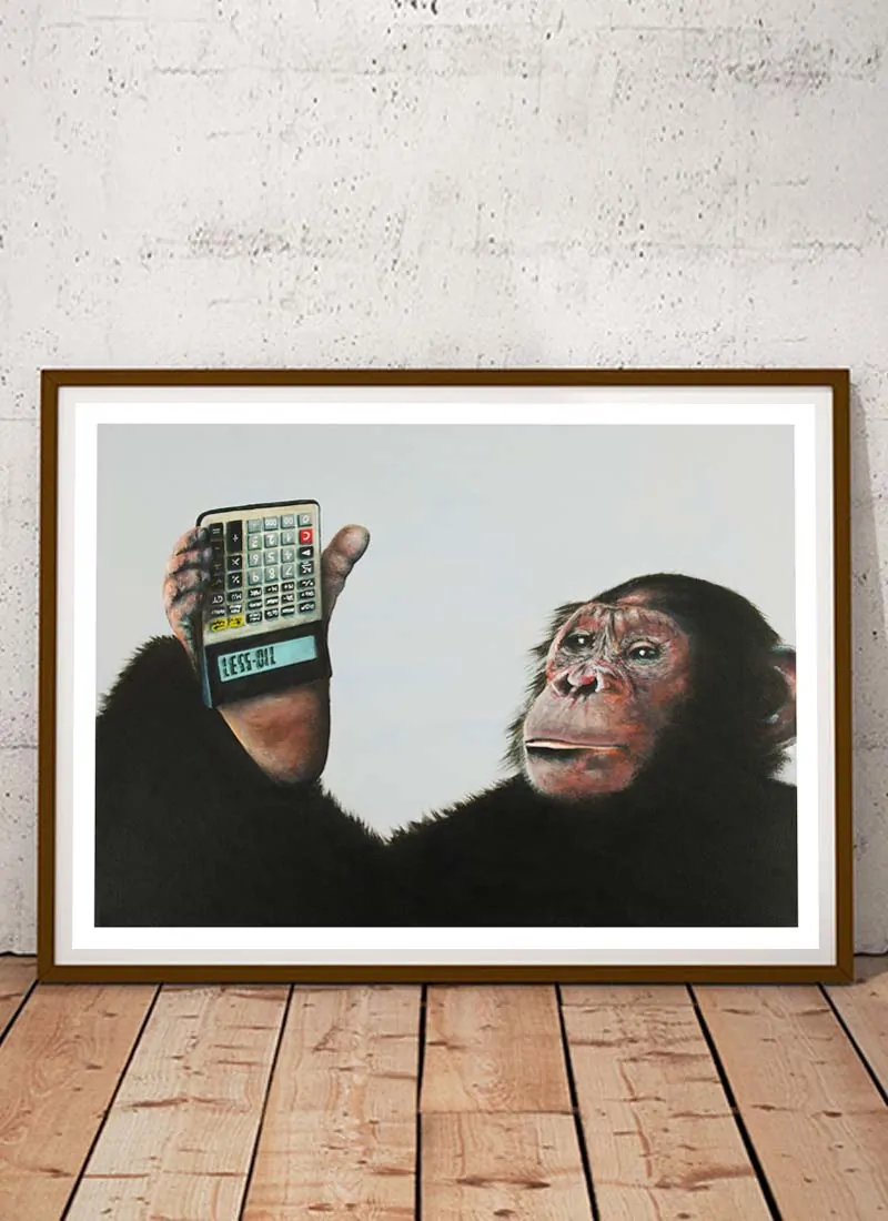 Chimpanzee holding a calculator upside down that spells out less oil in protest to the destruction of their habitat to make way for palm oil production