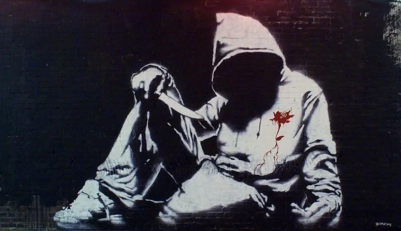 The hooded youth piece signed by Banksy. This appeared at the Cans Festival in London 2008