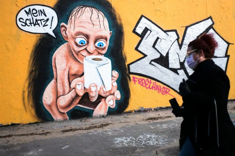 German street art depicts Golem staring longingly at a toilet roll