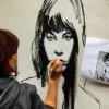 Raffaella Bertolini busy working on her piece for the Cheltenham Paint Festival 2018 (photo by Anthony Harp)