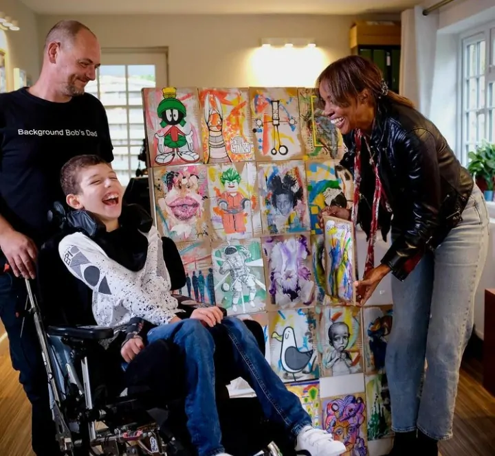 Noah and his Dad, Nathan, meeting Josie d'Arby for their interview on Sunday Morning Live